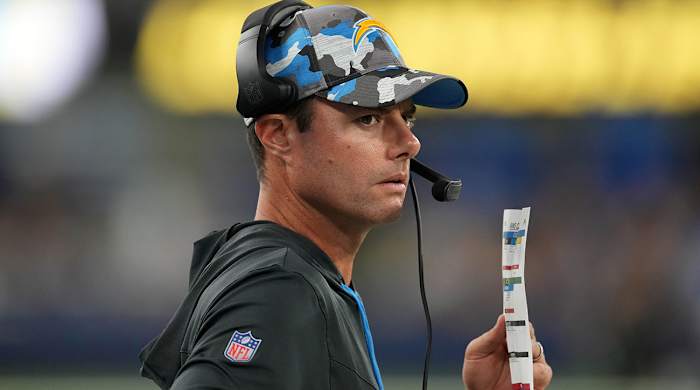 Brandon Staley calling plays during a preseason game